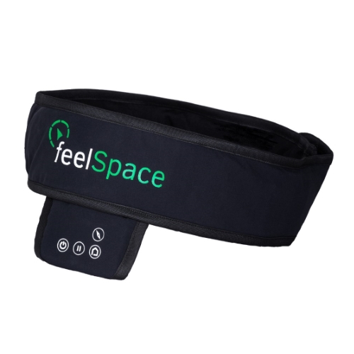 Diapo 2 : Gros plan sur la ceinture Navibelt, le logo FeelSpace est visible.