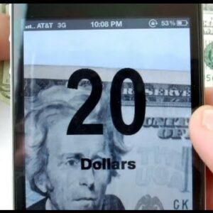 Photo d’un téléphone qui indique le somme et la devise du billet pris en photo avec l’application Money Reader